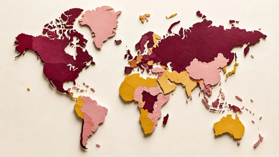 Paper-cut illustration of a world map made of separate cut-out continents